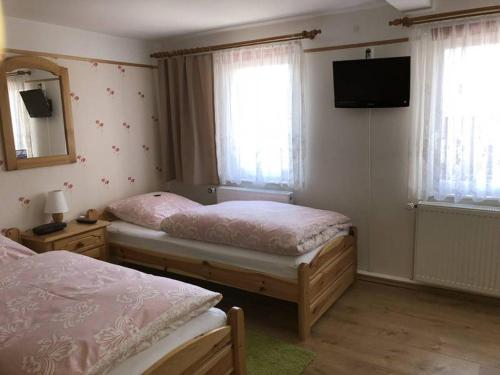 Кровать или кровати в номере Haus Stadtflucht