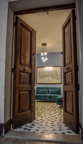 an open door to a living room with a couch at U'Panare in Taranto