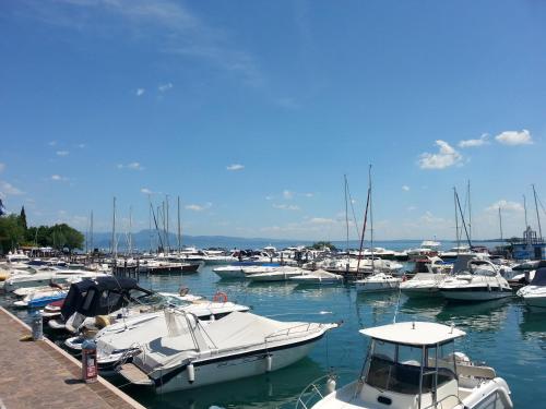 a bunch of boats docked in a harbor at Relais Rosa Dei Venti -Ciao Vacanze- in Moniga