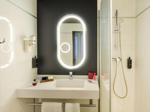 a bathroom with a sink and a mirror at ibis Paris Gare De L Est 10ème in Paris