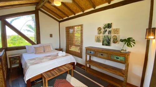 מיטה או מיטות בחדר ב-Taipu Loft - Península de Maraú