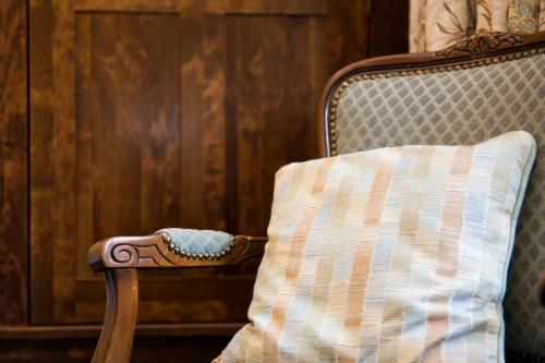 a pillow sitting on a chair in a room at Hazel Bank Country House Borrowdale Valley in Rosthwaite