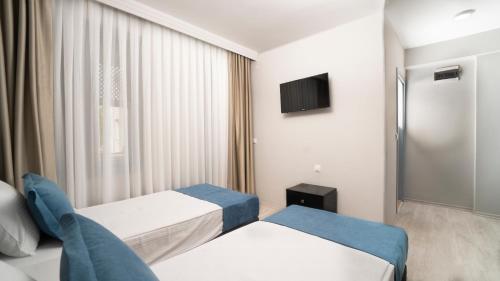 Letto o letti in una camera di OPERA Hotel Antalya