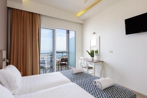 Ένα ή περισσότερα κρεβάτια σε δωμάτιο στο Atali Grand Resort