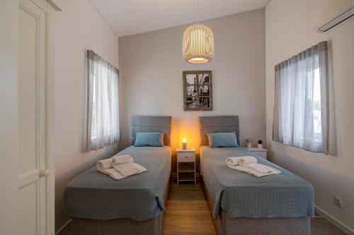 Katil atau katil-katil dalam bilik di Casa Estrela do Mar