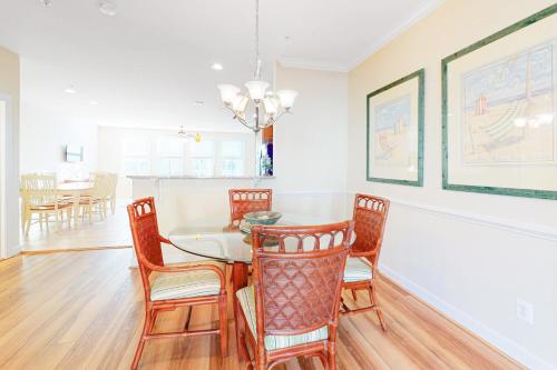 a dining room with a table and chairs at Sunset Island - 35 Seaside in Ocean City