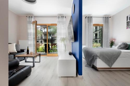 Posteľ alebo postele v izbe v ubytovaní Elite Apartments Nadmotławie Prestige