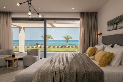 Кровать или кровати в номере Nerea SeaFront Villa, a Pristine Retreat, By ThinkVilla