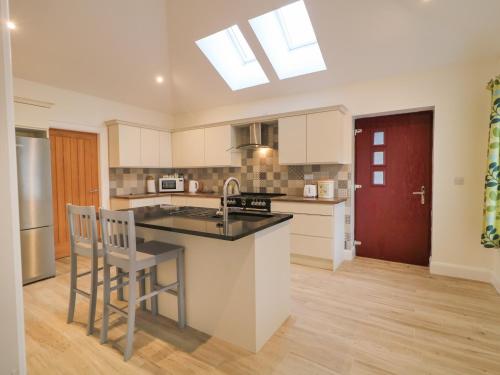 a kitchen with a sink and a counter top at Sliabh Amharc in Downpatrick