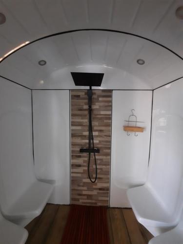 a room with white walls and a ceiling at Rêves de vie le "port pin" vue mer, petite piscine, jacuzzi, parking PRIVES in Cassis