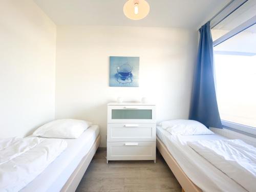 Ένα ή περισσότερα κρεβάτια σε δωμάτιο στο Vakantie appartement WE08