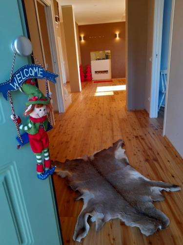 a christmas decoration of a santa claus standing next to a large rug at Atena in La Spezia