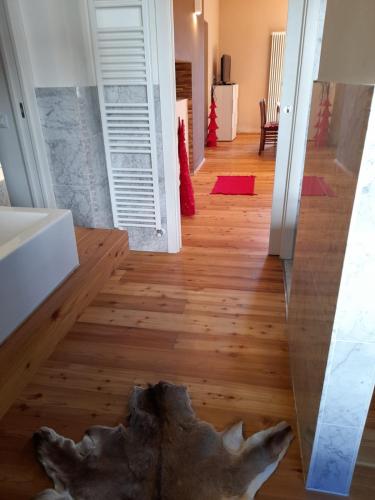 a view from the hallway of a house with a large rock on the floor at Atena in La Spezia