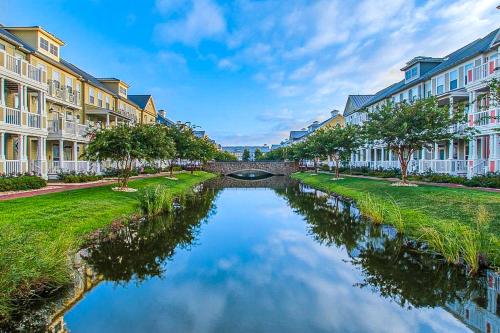 a canal in a city with buildings and a bridge at Sunset Island - 35 Seaside in Ocean City