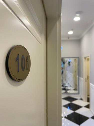 a room with a number on the wall at Moss Art Boutique Hotel in Baku