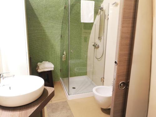 a bathroom with a shower and a sink and a toilet at Sweet Home Arco Porta Luce in Galatina