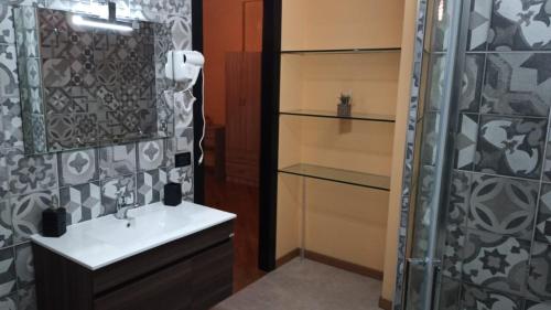 a bathroom with a sink and a shower at b b desy in Caserta