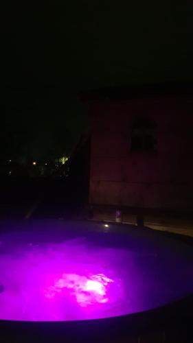a purple light on the top of a swimming pool at night at Ziedu aleja in Sigulda