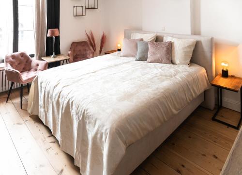 Postel nebo postele na pokoji v ubytování B&B landhuis Hauwaart 80