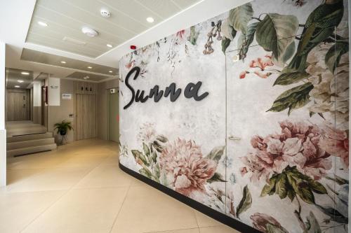 a lobby with a spa sign on the wall at Hotel Sunna Benicassim in Benicàssim
