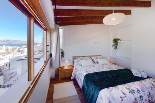 A bed or beds in a room at Apartamento de diseño en Casco antiguo Altea