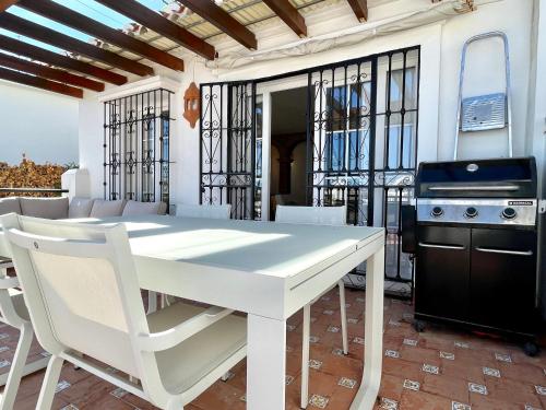Semidetached Duplex home at Puebla Aida, Mijas Golf with pool, golf and sea views