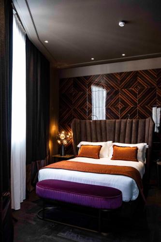 Postel nebo postele na pokoji v ubytování U-Visionary Roma Hotel