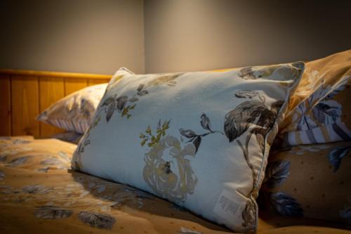 a pillow sitting on top of a bed at The Ash Shepod - Smardale Mill in Smardale