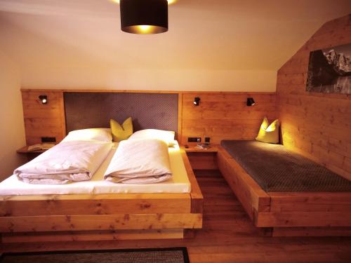 a bedroom with two beds in a room at rima apartments in Hippach