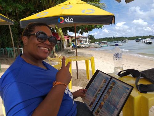 a man giving a thumbs up at the beach at Casa Beija-flor Pousada in Ilha de Boipeba