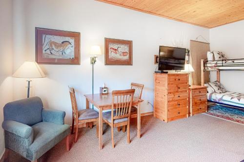 a room with a dining room table and a bedroom at Gateway #5055 in Keystone