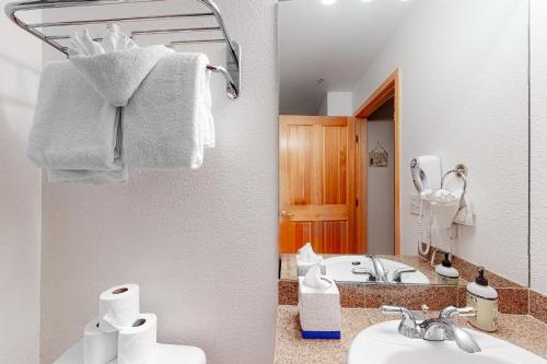 a bathroom with a sink and a mirror at Gateway #5055 in Keystone