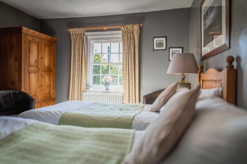 Katil atau katil-katil dalam bilik di The Old Hall Inn