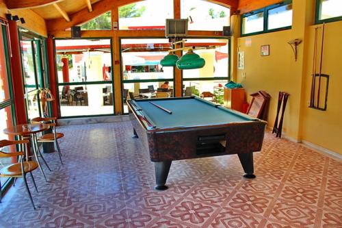 a pool table in the middle of a room at Mediterranean Blue in Kavos