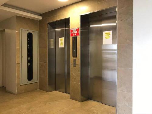 an elevator in a building with a sign on it at 2 room department (5 people). Private exclusive area in Guayaquil in Guayaquil