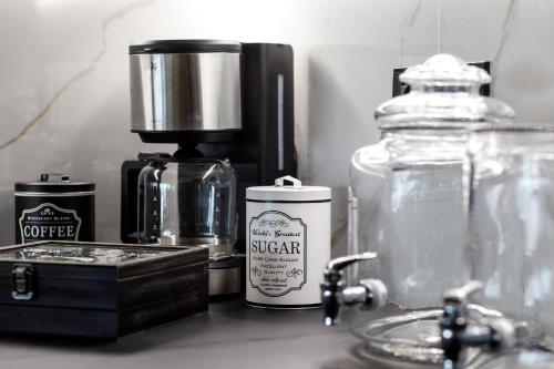 a counter top with a coffee maker and a can on it at KingsResidenceVilla in Nafplio