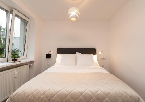 Postel nebo postele na pokoji v ubytování Stadium apartment