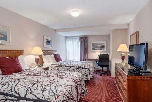 Ένα ή περισσότερα κρεβάτια σε δωμάτιο στο Best Western Plus Portsmouth Hotel & Suites