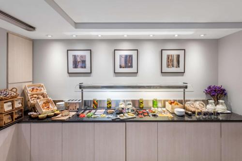 a buffet line with many different types of food at Paradox Sydney in Sydney