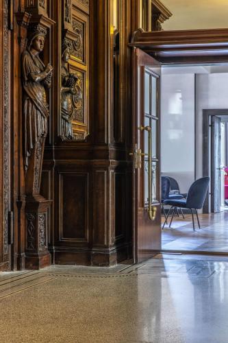 a room with a door with a statue on the wall at Radisson Blu Hotel Schwarzer Bock Wiesbaden in Wiesbaden