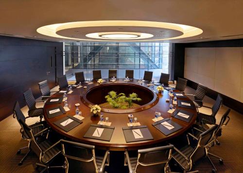 a large meeting room with a large table and chairs at Radisson Blu Chattogram Bay View in Chittagong