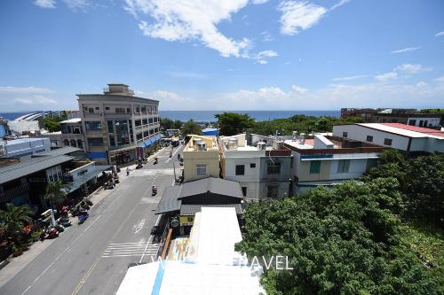an aerial view of a city street with buildings at Mini BnB in Xiaoliuqiu