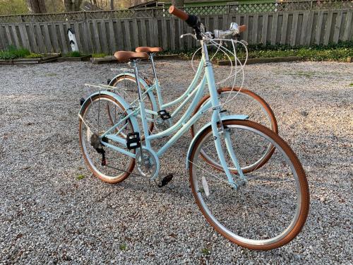 a blue bike is parked on the gravel at Garden Grove Inn Bed and Breakfast in Union Pier
