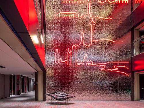 a wall in a building with a mural of a city at Radisson RED Hotel Zhuhai Gongbei Port in Zhuhai