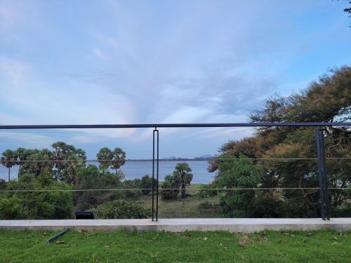 a view of the water from a balcony at Arachchi Heritage in Anuradhapura