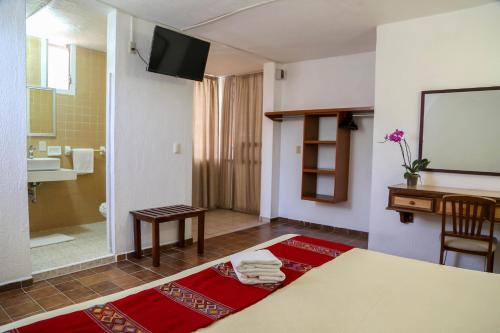 Postel nebo postele na pokoji v ubytování Vallartasol Hotel