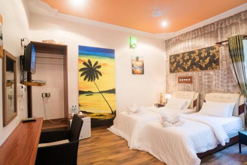 Postel nebo postele na pokoji v ubytování Coral Queen Villa, Ukulhas