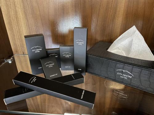 a box of products sitting on top of a table at City Centre Hotel in Tashkent
