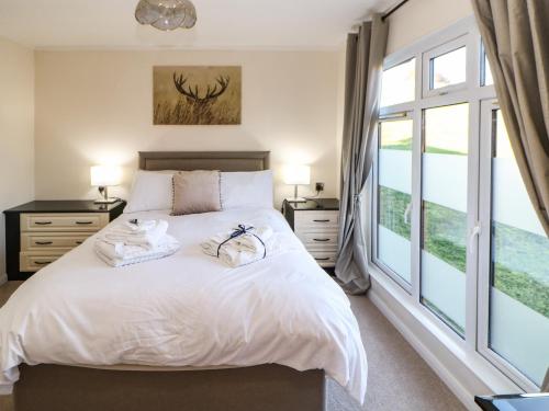 Un pat sau paturi într-o cameră la Badgers Retreat