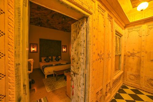 a hallway with a room with a bed in it at Garh Meera - A Sensational Boutique Hotel in Jaisalmer